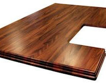 African Mahogany Island top with Walnut Stain.  Edge Grain construction with book-matched drop edges.