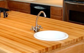 Edge Grain Hard Maple Island Top with drop in sink and Waterlox finish