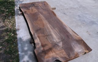 Two book-matched walnut slabs.  These slabs were used to form the main part of an island top.  A smaller slab was also incorporated to achieve the final shape