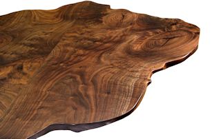 Walnut slab pieces used to make a smaller wood island top.  This top has wane edges and waterlox satin finish.