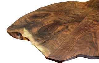 Walnut slab pieces used to make a smaller wood island top.  This top has wane edges and waterlox satin finish.
