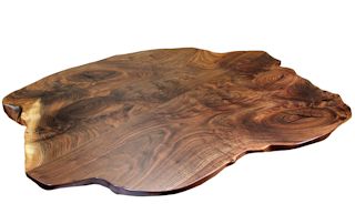 Walnut slab pieces used to make a smaller wood island top.  This top has wane edges and waterlox satin finish.