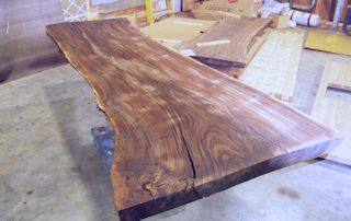 One of two book-matched walnut slabs. These slabs were used to create a rectangular kitchen island top with dog-ear corners.