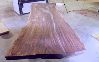 One of two book-matched walnut slabs.  These slabs were used to create a rectangular kitchen island top with dog-ear corners.