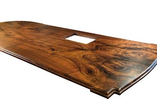 Island top constructed from two sets of book-matched Walnut slab pieces.  This top has a roman ogee edge profile and waterlox satin finish.