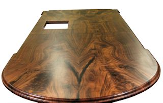 Island top constructed from two sets of book-matched Walnut slab pieces.  This top has a roman ogee edge profile and waterlox satin finish.