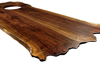 Custom Walnut island top from two book-matched slabs. Sculpted wane edges and Waterlox satin finish