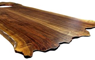Custom Walnut island top from two book-matched slabs. Sculpted wane edges and Waterlox satin finish