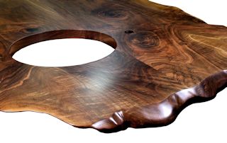 Custom Walnut island top from two book-matched slabs. Sculpted wane edges and Waterlox satin finish