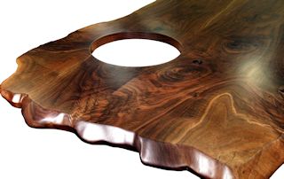 Custom Walnut island top from two book-matched slabs. Sculpted wane edges and Waterlox satin finish