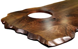 Custom Walnut island top from two book-matched slabs. Sculpted wane edges and Waterlox satin finish