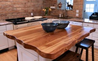 Reclaimed Longleaf Pine island top with Faux Wane Edges and a Waterlox Semi-gloss finish.