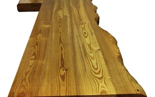 Reclaimed Longleaf Pine island top with Contemporary Style Faux Wane Edges and a Waterlox Semi-gloss finish.