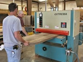 Running a glued up panel through the wide belt sander