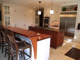 Jatoba edge grain countertop and bar top with custom corbels.