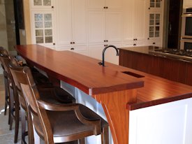 Jatoba edge grain countertop and bar top with custom corbels.