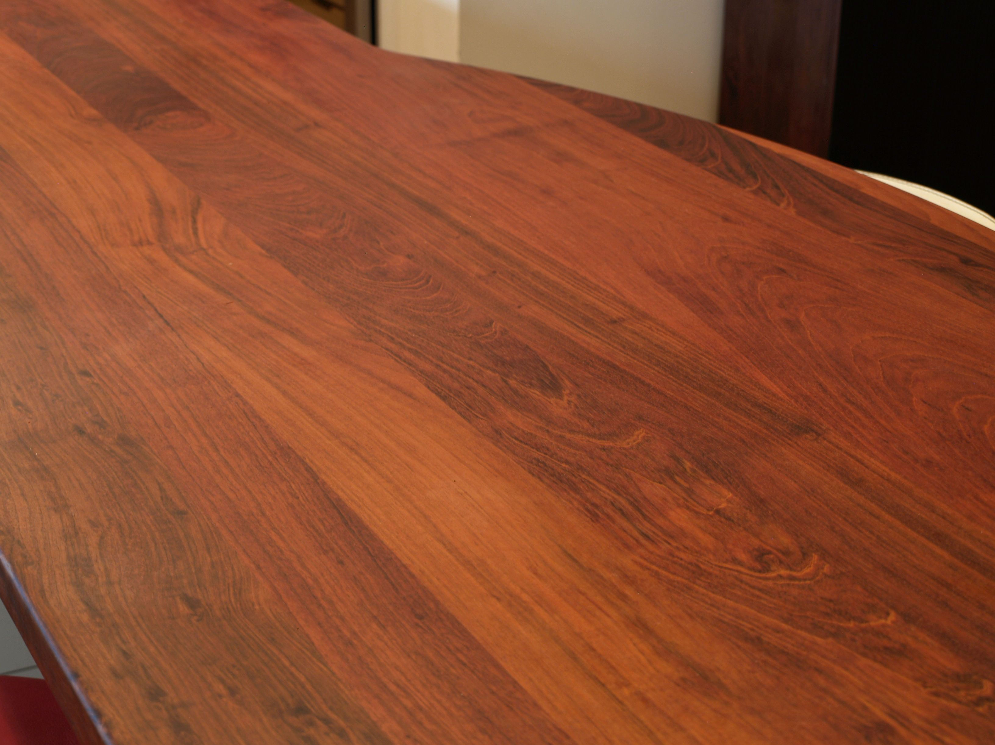 Jatoba face grain island countertop with Tung Oil Citrus finish.  Custom metal base designed by DeVos Custom Woodworking.