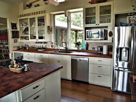 Mesquite parquet-style end grain wood island countertop and edge grain countertop.