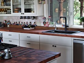 Mesquite parquet-style end grain wood island countertop and edge grain countertop.