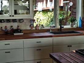 Mesquite parquet-style end grain wood island countertop and edge grain countertop.