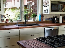 Mesquite parquet-style end grain wood island countertop and edge grain countertop.