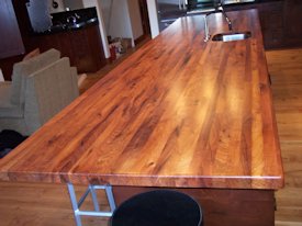 Mesquite wide strip edge grain island countertop.