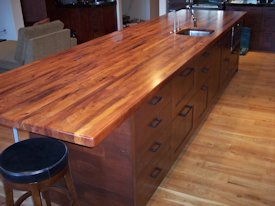 Mesquite wide strip edge grain island countertop.