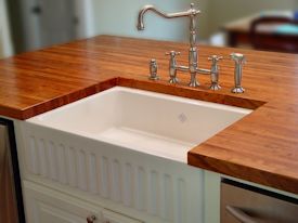 Edge Grain Mesquite Island Top with farm sink and Waterlox finish