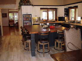 Mesquite parquet-style end grain island countertop with Stainless Steel Grids and Tung-oil finish. 