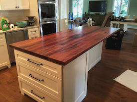 Mesquite face grain island countertop with Waterlox Satin Finish.