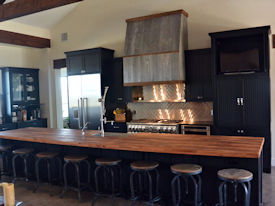 Reclaimed Boxcar Flooring edge grain wood island countertop with Tung-Oil finish.