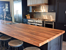 Reclaimed Boxcar Flooring edge grain wood island countertop with Tung-Oil finish.
