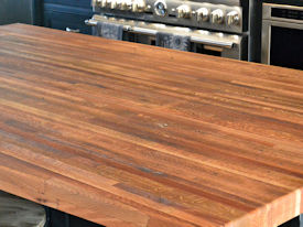 Reclaimed Boxcar Flooring edge grain wood island countertop with Tung-Oil finish.