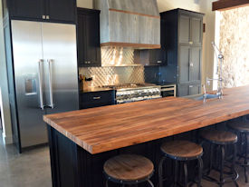 Reclaimed Boxcar Flooring edge grain wood island countertop with Tung-Oil finish.