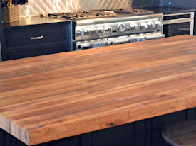 Reclaimed Boxcar Flooring edge grain wood island countertop with Tung-Oil finish.