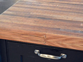 Reclaimed Boxcar Flooring edge grain wood island countertop with Tung-Oil finish.