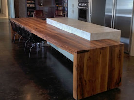 Contemporary Reclaimed White Oak custom wood island with DeVos Puzzle Joint along the length.  Finger Joint ends with Waterfall return to the floor and Tung-Oil finish.