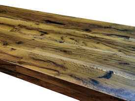 Contemporary Reclaimed White Oak custom wood island with DeVos Puzzle Joint along the length.  Finger Joint ends with Waterfall return to the floor and Tung-Oil finish.