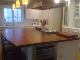 Santos Mahogany edge grain wood island countertop with Waterlox Semigloss finish.