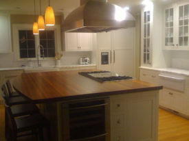 Santos Mahogany edge grain wood island countertop with Waterlox Semigloss finish.