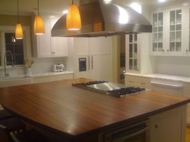 Santos Mahogany edge grain wood island countertop with Waterlox Semigloss finish.