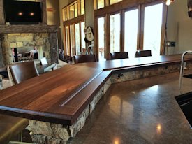 Slab Walnut face grain custom wood bar top.