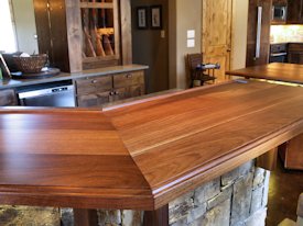 Slab Walnut face grain custom wood bar top.