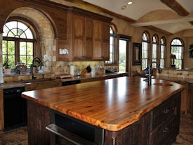 Texas Pecan book matched slab wood island top with Natural Edges and an integrated Texas Pecan Sink.  Waterlox Satin finish.