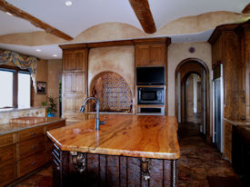 Texas Pecan book matched slab wood island top with Natural Edges and an integrated Texas Pecan Sink.  Waterlox Satin finish.