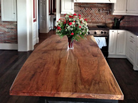 Texas Pecan slab wood island top with Waterlox Satin finish.