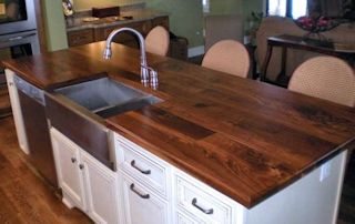 Face Grain Walnut Island Top with farm sink and Waterlox finish