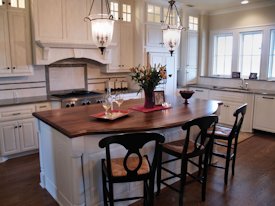 Walnut face grain wood island countertop.