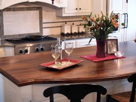 Walnut face grain wood island countertop.