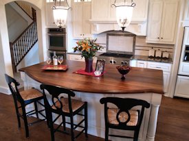 Walnut face grain wood island countertop.